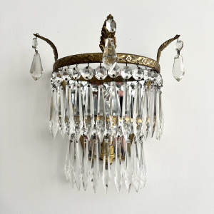 A pair of early 20th century brass and glass wall lights