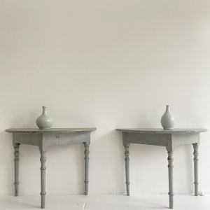 A pair of 19th century Swedish demi lune console tables