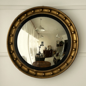 An early 20th century large Regency taste convex mirror