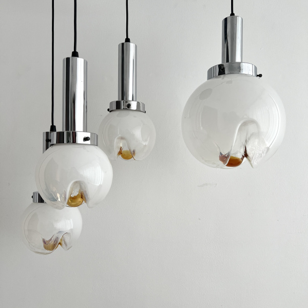 A Mezzega chandelier in a cascading trio of opaline to amber glass from the 1970s image
