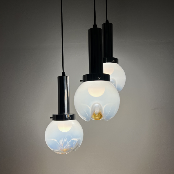 A Mezzega chandelier in a cascading trio of opaline to amber glass from the 1970s image